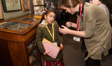 child talking to museum staff